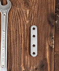 40Pcs Stainless Steel Flat Straight Braces Set With Precision Flat Design And Smooth Surface Finish on wooden background