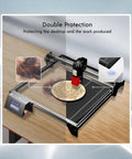 Beast Mode 20W Laser Engraver with Air Pump on 440 mm by 440 mm honeycomb bed, showing double protection on wooden design