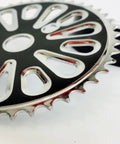 Close-up of black 44 tooth sprocket from the Wide Pedal Crank Kit One Piece Crank for Two Stroke Gas Motorized Bicycle