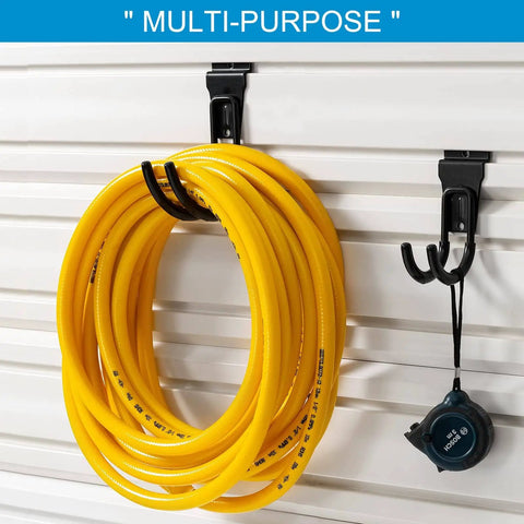 16 Pack Slatwall Hooks For Garage Storage, Heavy Duty Slat Wall Hangers In Black holding a yellow hose and tool on a slatwall panel.