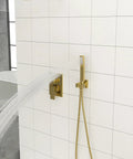 Wall Mounted Square Shower System with Rough-in Valve, gold finish, stainless steel, with handheld shower, water flow in bathroom.