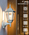Durable Outdoor Wall Light With Dusk To Dawn Sensor, White Anti Corrosion Plastic Fixture lit in rain showing IP44 waterproofing