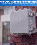 Premium Four Pack Waterproof Electrical Junction Box Outdoor IP67 Plastic Weatherproof Enclosure Gray on a brick wall with rain.