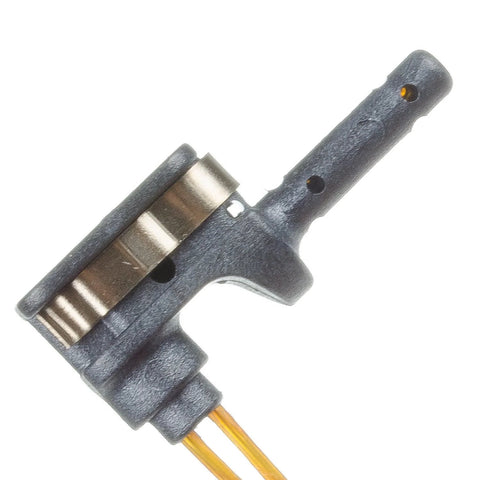 Brake wear sensor with gray plastic housing and two gold-plated leads, angled close-up view