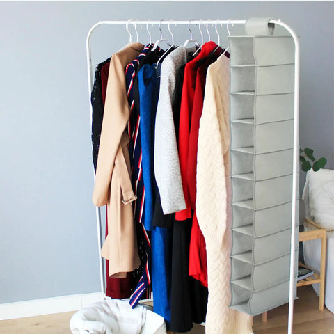 Hella Handy 10 Layer Hanging Shoe Rack Saves Gobs Of Space Perfect For Boots Sneakers Hats And Bags With An Easy Fold Up Design hangs beside clothes.