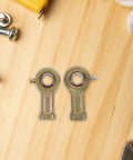 2 Pack Rig Ready Rod End Bearings 14 MM And 9 16 Female Thread Tie Rod Ball Joints on wood surface with tools.