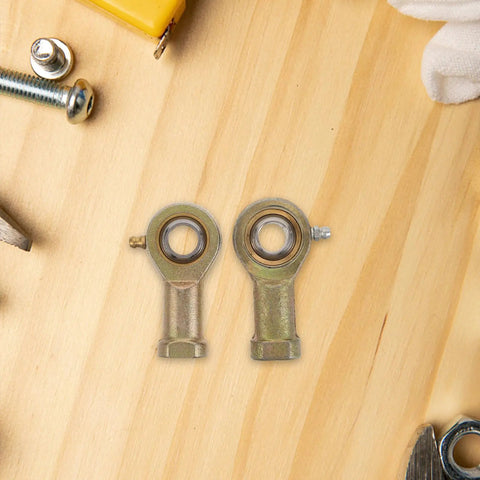 2 Pack Rig Ready Rod End Bearings 14 MM And 9 16 Female Thread Tie Rod Ball Joints on wood surface with tools.