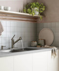 Spot Resist Stainless Single Handle Pull Out Sprayer Kitchen Faucet With Soap Dispenser and Power Clean in a modern kitchen setup