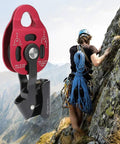 Aluminum Heavy Duty Single Swivel Rope Pulley Block For 8 To 12mm Climbing Rope in use during outdoor climbing on rocky terrain