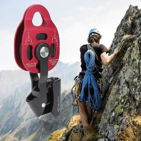 Aluminum Heavy Duty Single Swivel Rope Pulley Block For 8 To 12mm Climbing Rope in use during outdoor climbing on rocky terrain