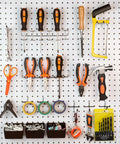 INCLY 120pcs pegboard accessories organizer kit on white pegboard with orange-handled tools, hooks and bins