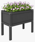 Raised Garden Bed With Drainage Hole Waterproof HDPE Elevated Planter Box With Legs Tough As Nails For Herbs Vegetables And Flowers Perfect For Patio Balcony Outdoors Or Indoors Black; side view with purple flowers.