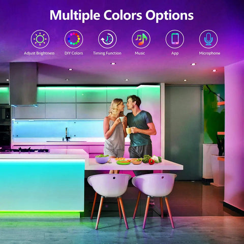 Couple in modern kitchen with 25 Foot RGB LED Strip Lights With App Control And Music Sync Dope Color Changing Tape Lights.