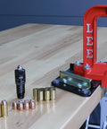 Dead Nuts Accurate Rifle Micrometer Adjustment Screw For Universal Bullet Seating Dies Infinite Tweakability Laser Engraved Point Zero One Inch Markings Silent Friction Ring Kills Clicks Smooth Die Swap For Gear Heads on a reloading press with bullets and brass cases.
