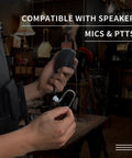 Person holding listen only earpiece with balanced armature driver for Motorola Icom ham radios, 3.5mm 1 pin plug