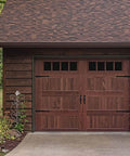 Decorative Rustic Carriage House Hardware Set With Black Steel Hinges And Handles For Barn Doors And Gates installed on wooden garage door