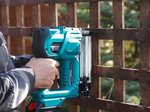Heavy Hitter Cordless 2 In 1 Brad Nailer And Staple Gun with 2000mAh battery used on wooden fence