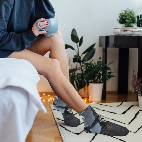Person wearing Death Scythe Ankle Socks With Moisture Wicking Tech in a cozy home setting