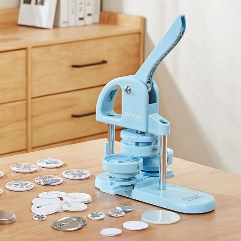 Three In One Button Maker Kit With 25mm 32mm And 58mm Sizes, Ergonomic Arc Handle Punch Press in blue on a wooden table.