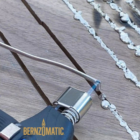 Compact Butane Torch Kit With Adjustable Precision Flame used on metalwork project surface, soldering in progress