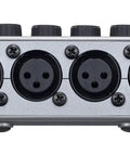Rear view of PodTrak P4 Dope Podcast Recorder with 4 XLR mic inputs, close-up on connectors.