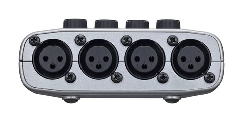 Rear view of PodTrak P4 Dope Podcast Recorder with 4 XLR mic inputs, close-up on connectors.
