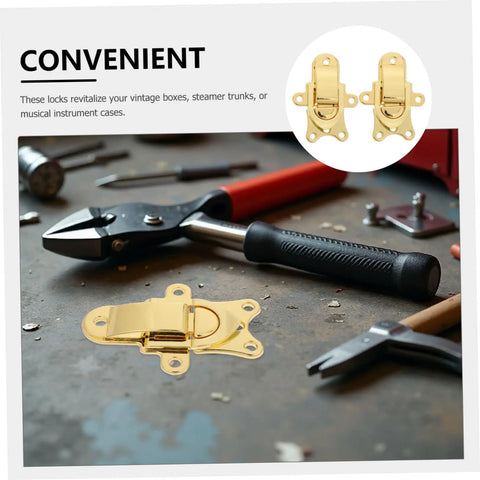 Durable Vintage Style Zinc Alloy Duckbill Toggle Latches 2 Pack on a work surface with tools, ideal for retro storage cases.