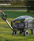 Person using Heavy-Duty Steel Utility Cart With 4 Cu Ft Bed And 900 LB Load Capacity, Black Towable Hauling Wagon on grass