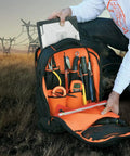 Open Rugged Tech Ready Laptop Backpack And Tool Bag For Pros Water Resistant Tech Pack showcasing tool pocket and orange interior.