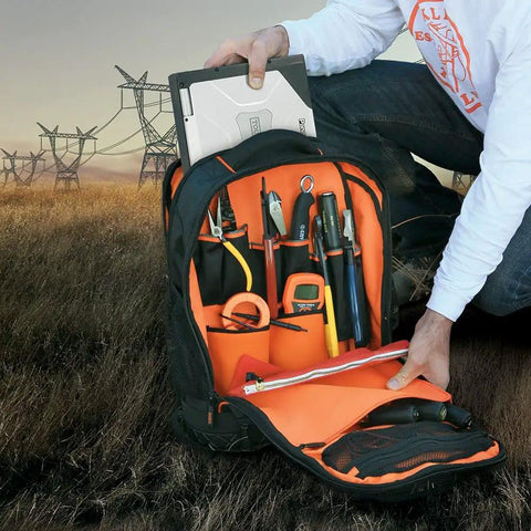 Open Rugged Tech Ready Laptop Backpack And Tool Bag For Pros Water Resistant Tech Pack showcasing tool pocket and orange interior.