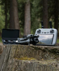 Ultra Light Palm Sized Drone Dope Fly More Bundle With RC 2 4K Video 36 Min Flight Time on stump with controller outdoors