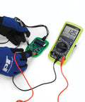 Automotive Digital Multimeter With Extra Large LCD Display And UL Listed Probes in use for bench electrical testing