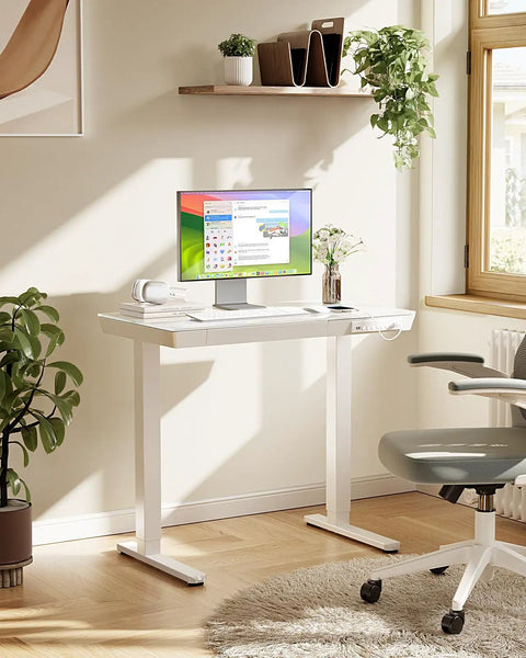 Heavy Duty Glass Electric Standing Desk With Effortless Height Control For Compact Home Office Setup 35 X 20 Inch in bright room.