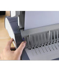 Dead Simple Desktop Comb Binding Machine That Crushes 25 Sheets Fast And Locks Up To 500 Pages in use with paper guide.