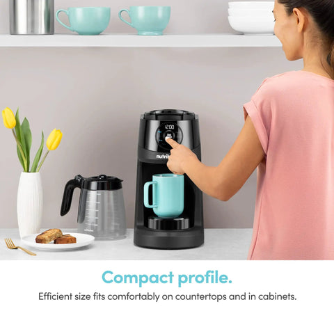 Woman using Brew Choice Pod and Carafe Coffee Maker for K Cup Pods or Ground Coffee, 12 Cup Capacity, on countertop
