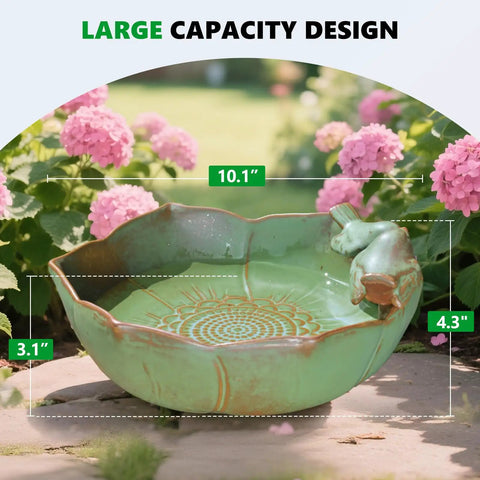 Outdoor Ceramic Bird Bath Built To Last 10.1 Inch Ground Bowl Weather Resistant Garden Bird Bath For Deck Balcony Lawn All Weather Glazed Non Toxic Finish Safe For Birds Squirrels Pollinators with sage-green glaze and floral design, shown in garden setting.