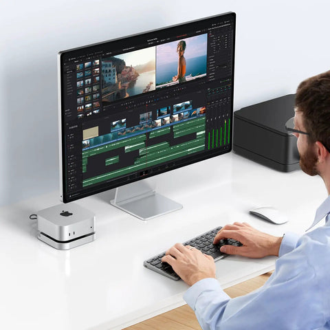 Person using a Mac Mini with a Plug And Play 40Gbps M2 NVMe SSD Enclosure For Mac Mini M4 And Pro for video editing.