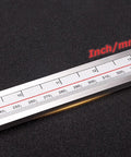 Built Tough Heavy Duty 40 Inch Digital Caliper With Extended Long Jaw For Deep Reach and Spot On Id Or Od Measurements In Metric And Imperial Units Featuring A Snappy Lcd Display close-up of measurement scale in inches and mm on caliper.