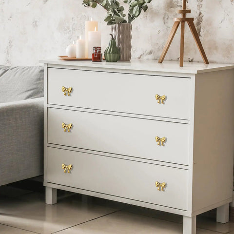 Dang Stylish Gold Bow Cabinet Handles Eight Pack Plus Heavy Duty Screws Easy Install Drawer Knobs For Dressers And Cabinets add elegance to white dresser.