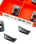Heavy Duty Indexable Carbide Lathe Tool For External Turning R390 11T308 Cutting Blade with R390 inserts in an orange case.
