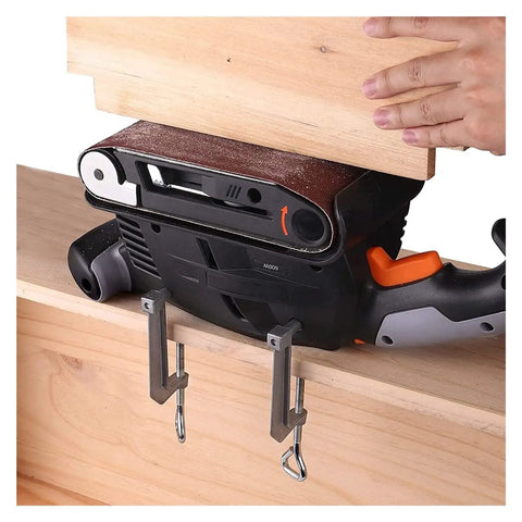 600 Watt Electric Belt Sander With Variable Speed Up To 560Rpm High Performance Copper Motor securing wood on a workbench.