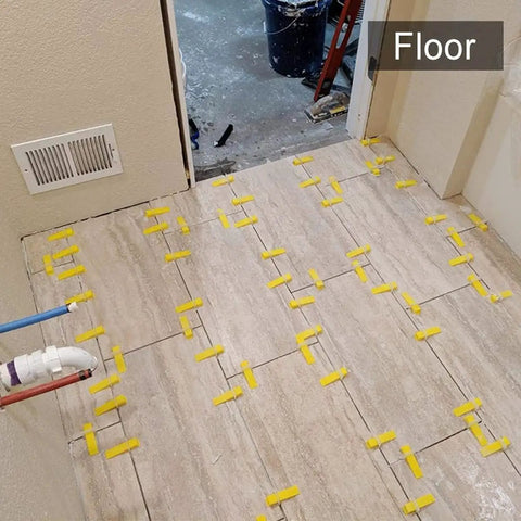 Tile Leveling System With Plier And 300 Clip Spacers And 100 Reusable Wedges For Stone And Tile Installations on tiled floor