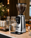 Electric Coffee Bean Grinder With 64mm Flat Burr And Digital Timer single and double dose modes sleek silver design on a kitchen counter.