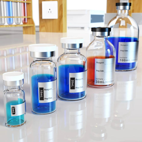 Front view of borosilicate glass reagent vials with white caps and metal crimp seals, blue liquids in varied sizes.