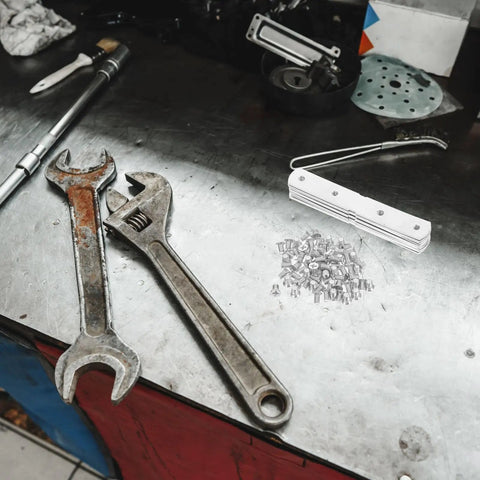 Workshop table with wrench, spanner, and Heavy Duty Stainless Steel Corner Brackets With Holes DIY Ready Set Of 10 For Wood And Metal