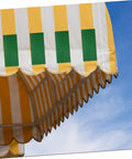 Heavy Duty Repair Tape Workhorse For Greenhouses Tents Canopies RV Awnings And Boats on a striped awning.