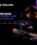 Tattoo artist using All In One Wireless Tattoo Pen Kit With OLED Display For Beginners Includes Cartridges Practice Skin Ink Cups Gloves Type C Cable And 2400mAh Battery For At Home Tattoo Practice on client's arm