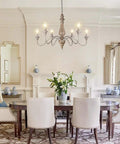 Elegant dining room with 6-Light French Country Farmhouse Chandelier For Dining Room And Living Room, Rustic Brown Distressed Wood, Vintage Rust Arm Detail, Cozy Bedroom Lighting, 29.5 Inch Diameter.
