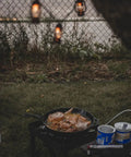 Beast 200K BTU Propane Burner For Outdoor Cooking with frying pan on heavy-duty stove in grassy area
