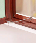 Set Of Four 1.5 Inch Galvanized Steel Swivel Latches Built Tough To Secure Cabin Doors Garden Gates And Storage Trunks Super Solid Hold No Nonsense Setup And All Required Mounting Screws Ready To Roll attached to wooden window frame.